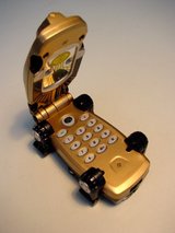 Beeldvergroting: Drieks nieuwe
                                mobieltje...